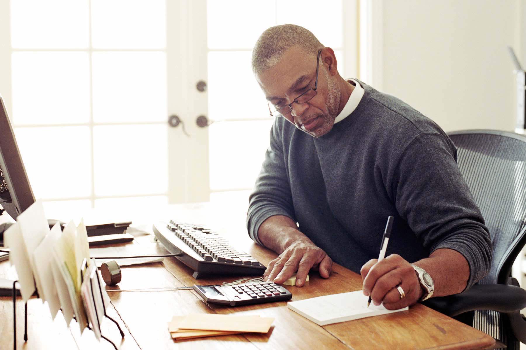 Mature man working in home office