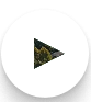 A play button overlaying an image of lush green hills on a big white circle.
