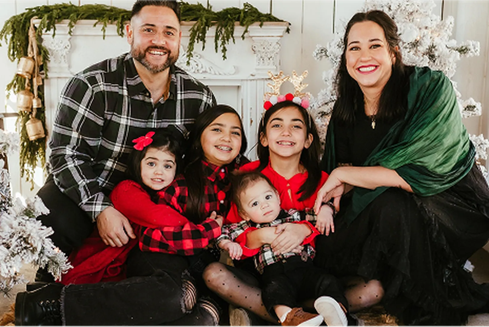 Adam Asuega, Senior Mortgage Advisor and Loan Officer, pictured with his family.