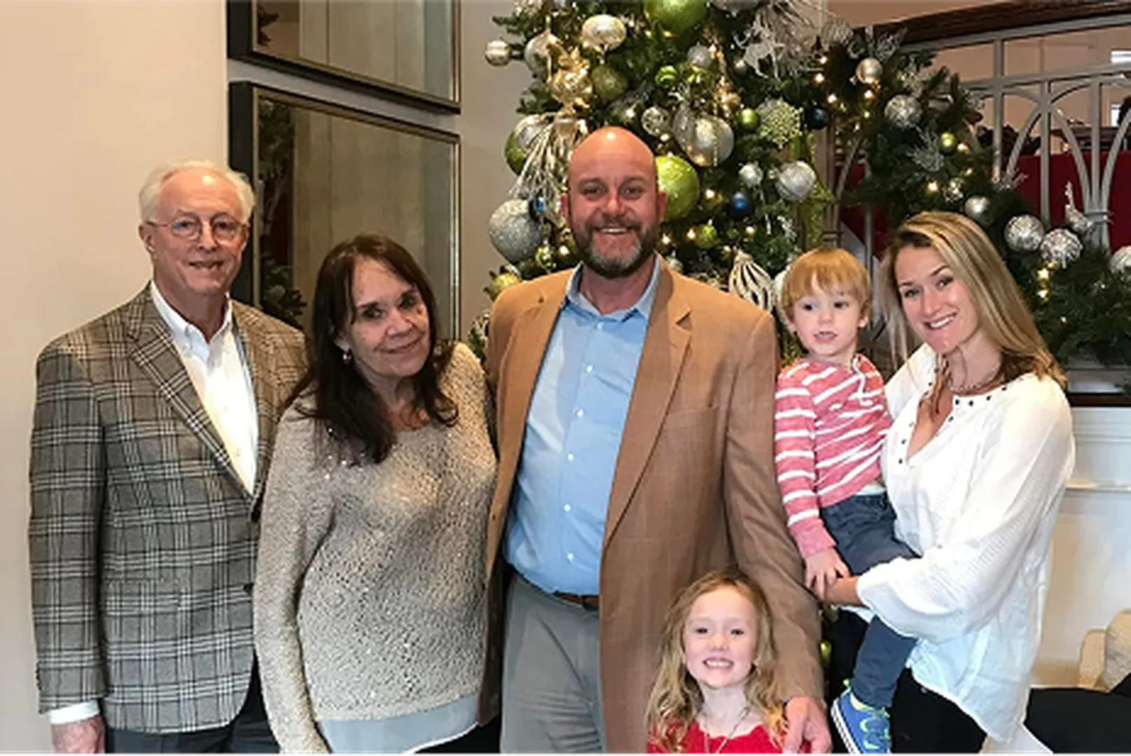 Andrew Kellam, Branch Manager and Loan Officer, with his wife, child, and parents.