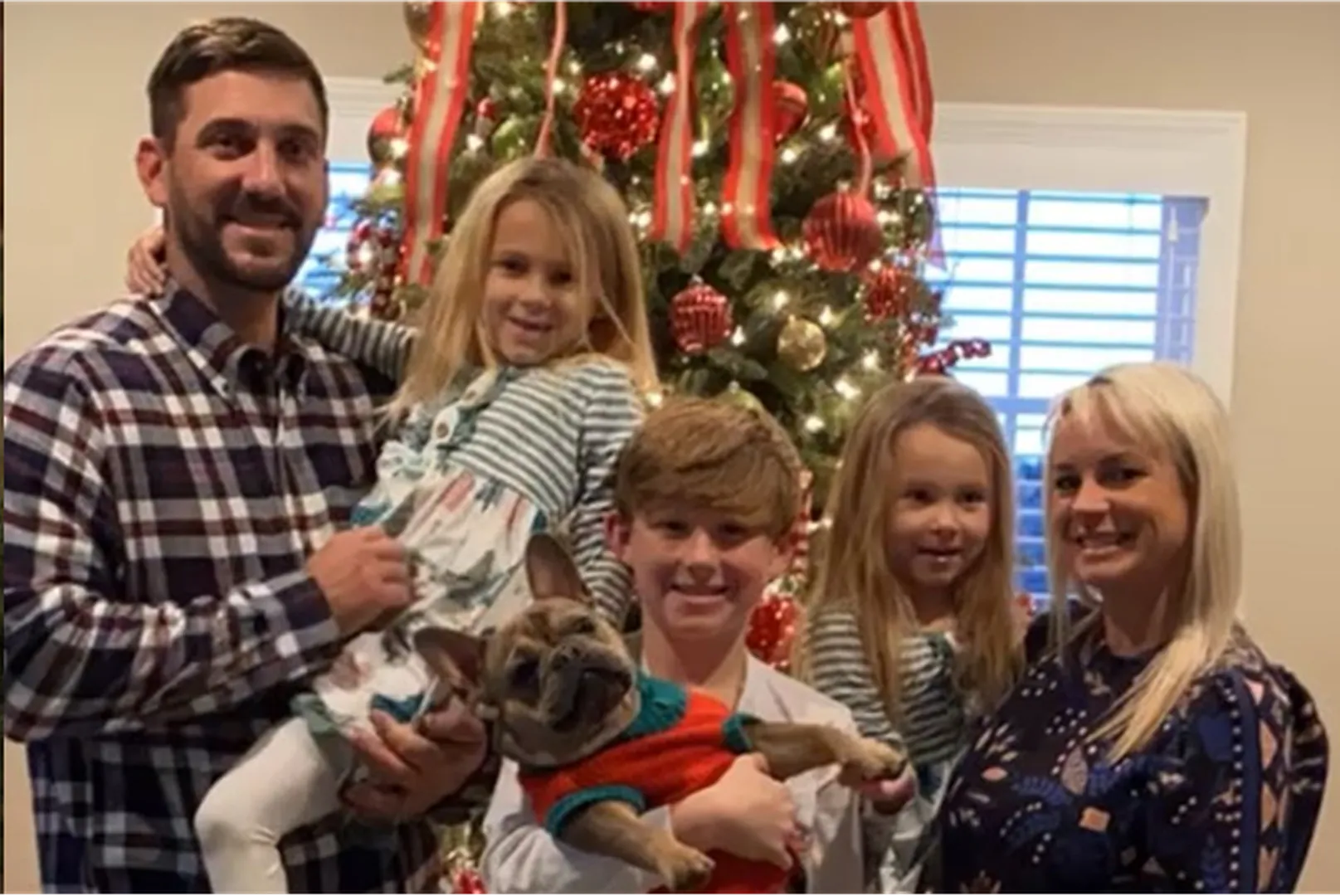 Ashley Bartol, Mortgage Loan Officer, posing with her family.