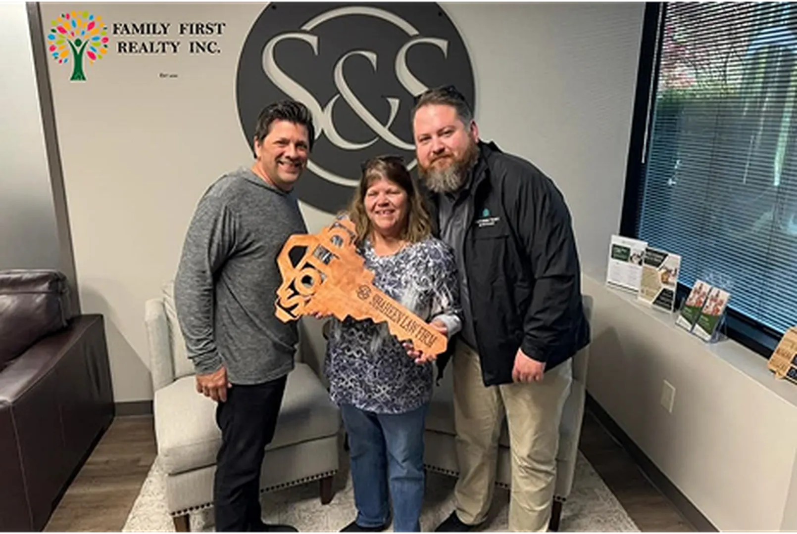 Benjamin Lacey, Mortgage Loan Officer, posing with his client.