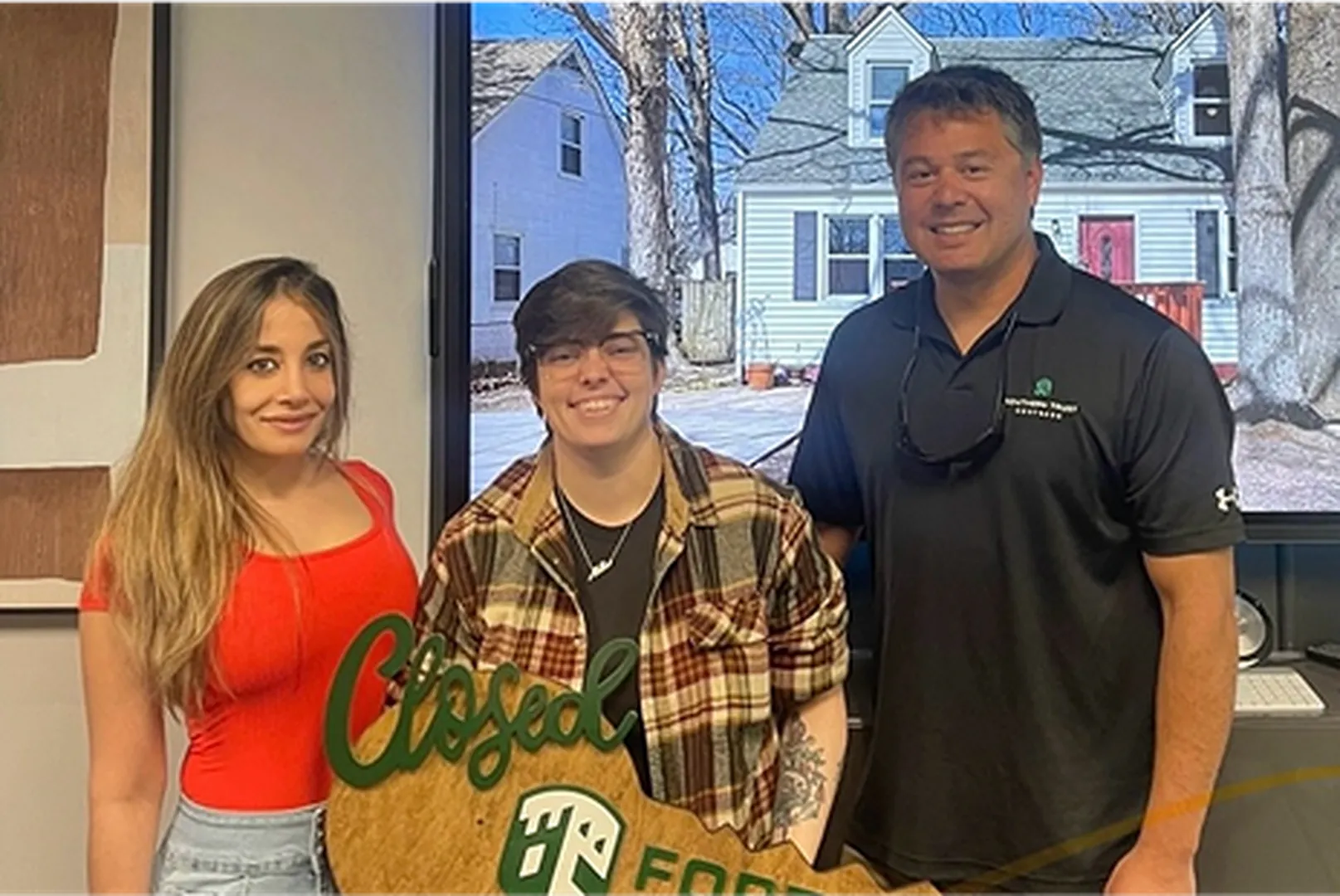 Brandon Beddie, Mortgage Loan Officer, with his client.