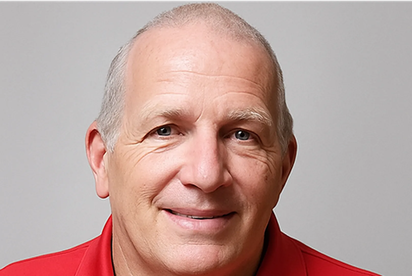 Don Ryan, Senior Loan Officer, wearing a red polo shirt.