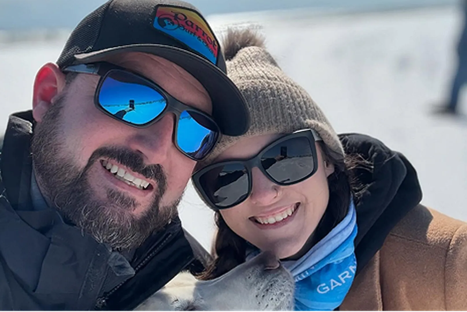 James Burton, Branch Manager, with his wife, wearing sunglasses and caps.