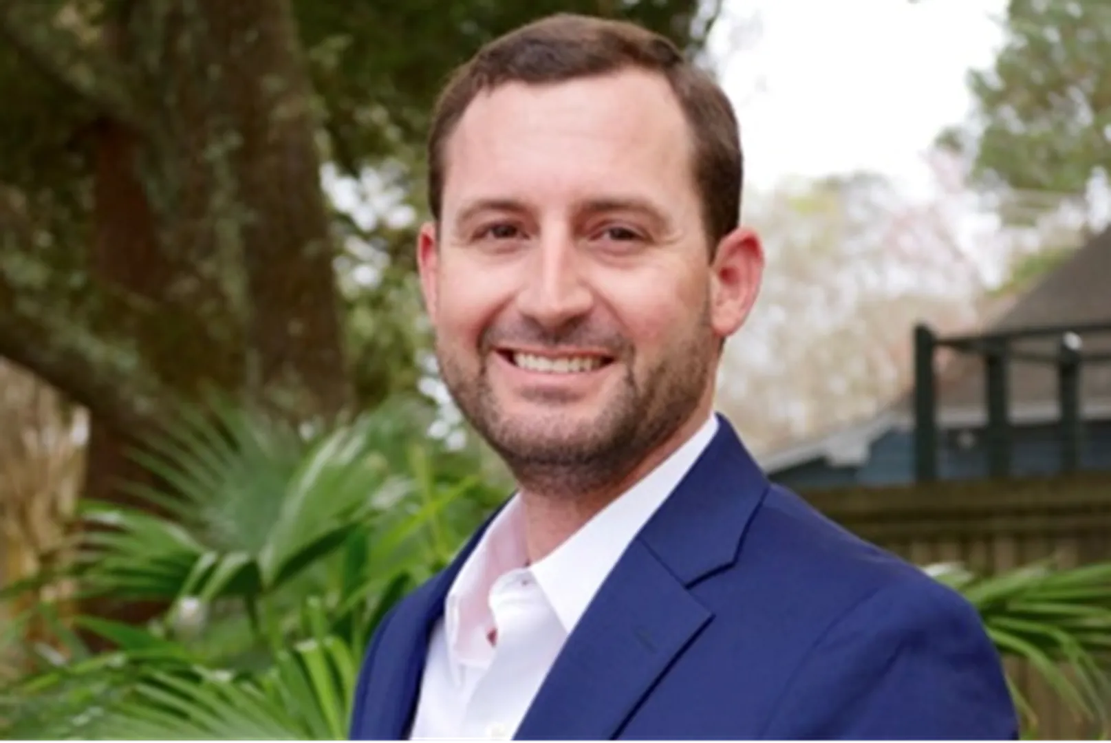 James Burton, Branch Manager, pictured outdoors in a professional portrait.