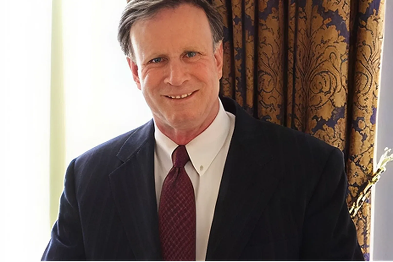 Larry Roussil, Mortgage Loan Officer, smiling in a professional portrait.