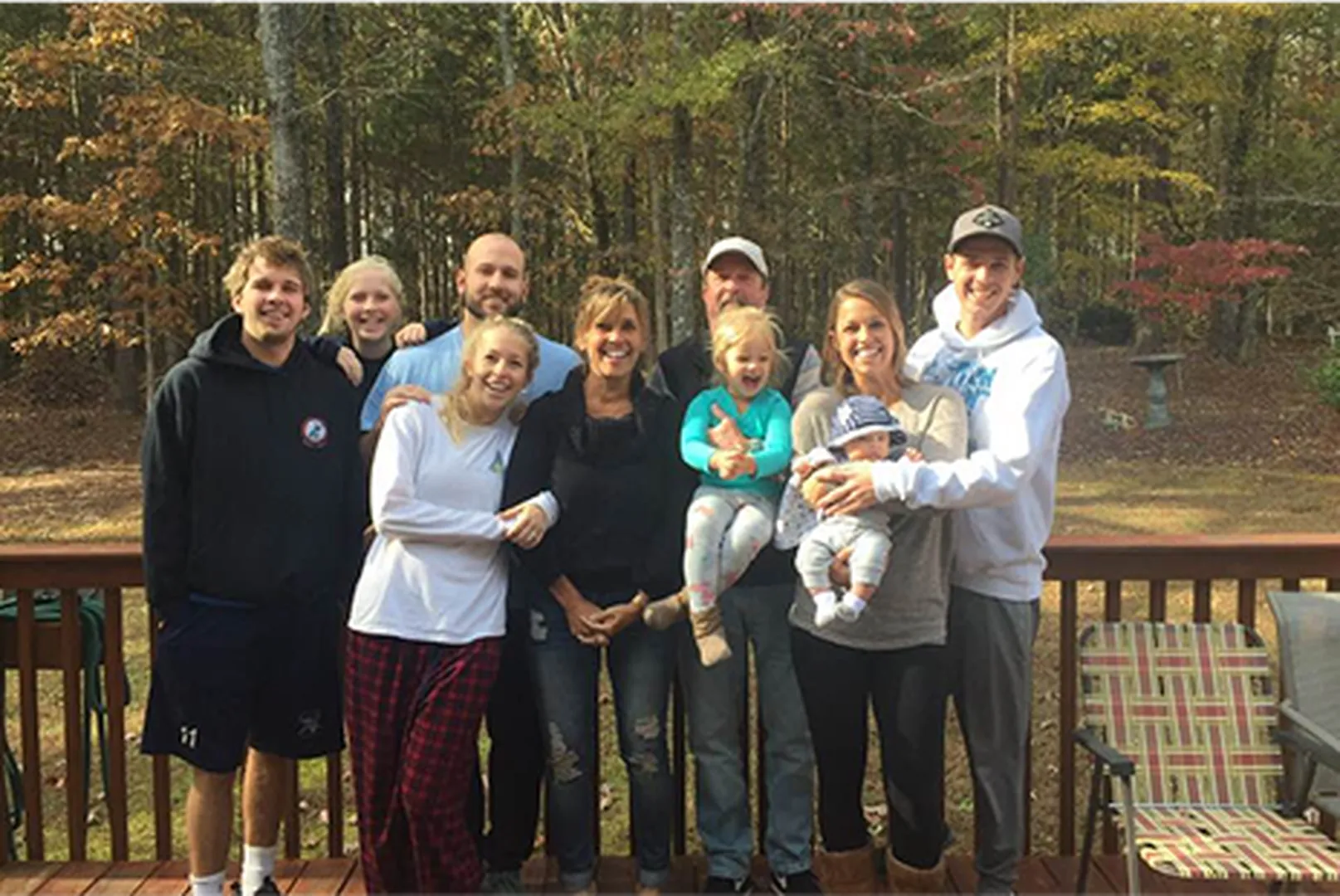 Libby Tamson, Mortgage Loan Officer, with her family members in the woods.
