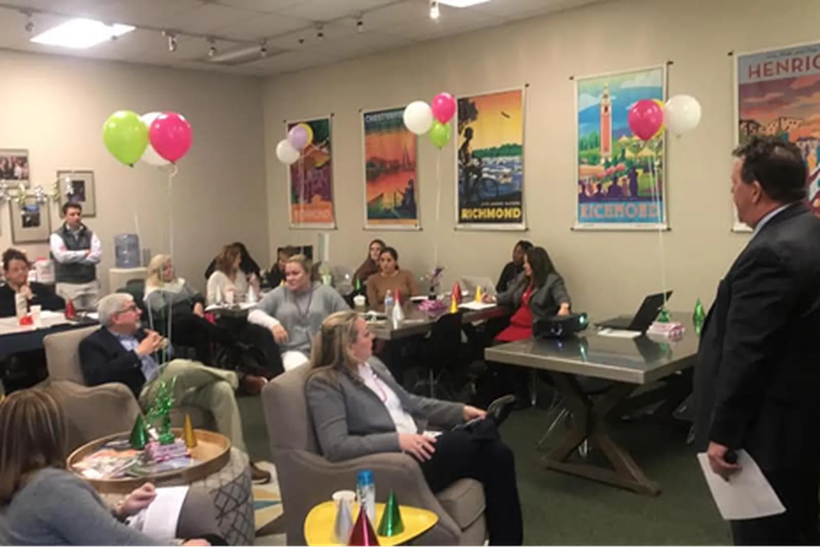 Mandy Moore, Mortgage Loan Officer, pictured with a group of people at an event.