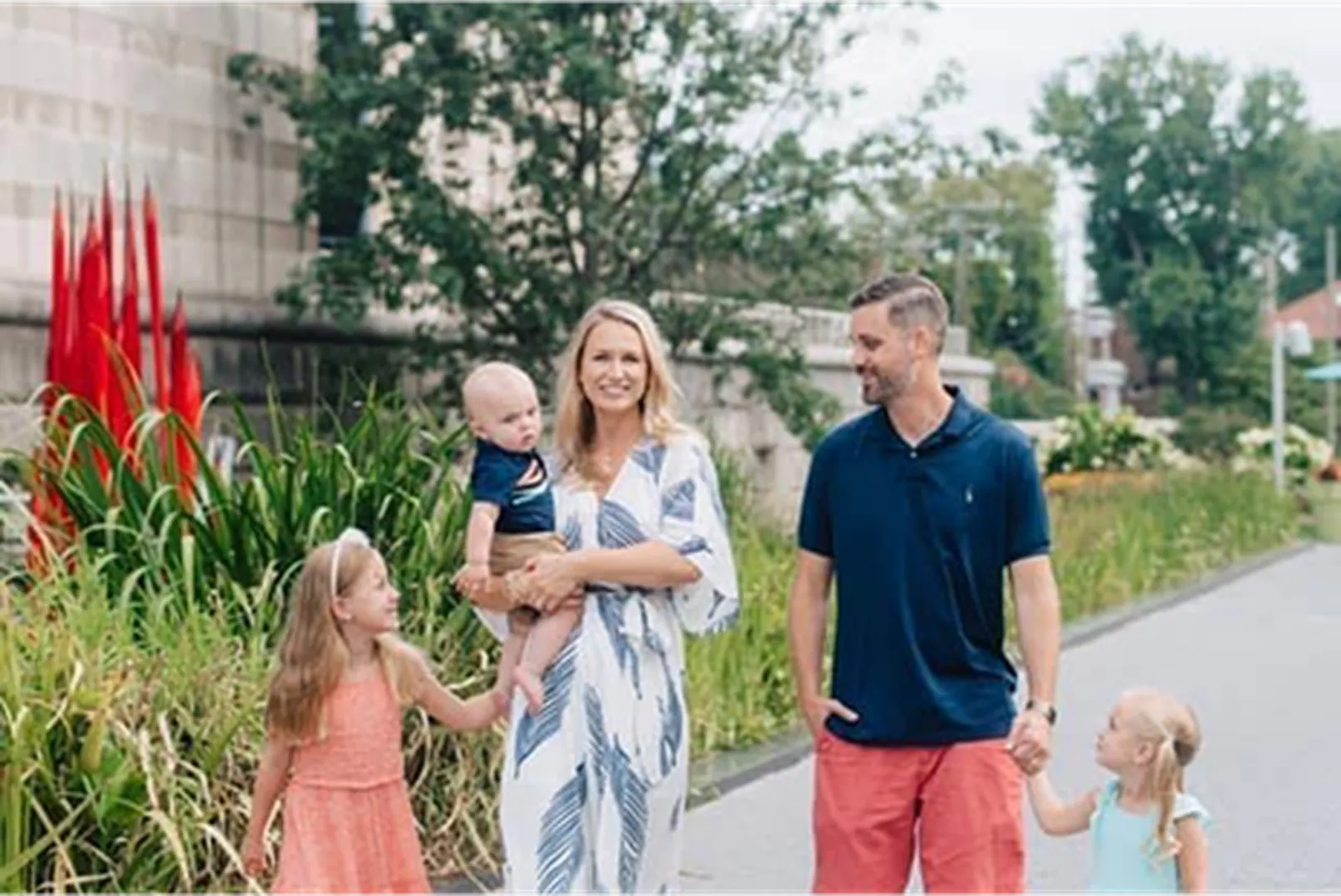 Mark Atkinson, Mortgage Loan Officer, with his wife and children walking outdoors.