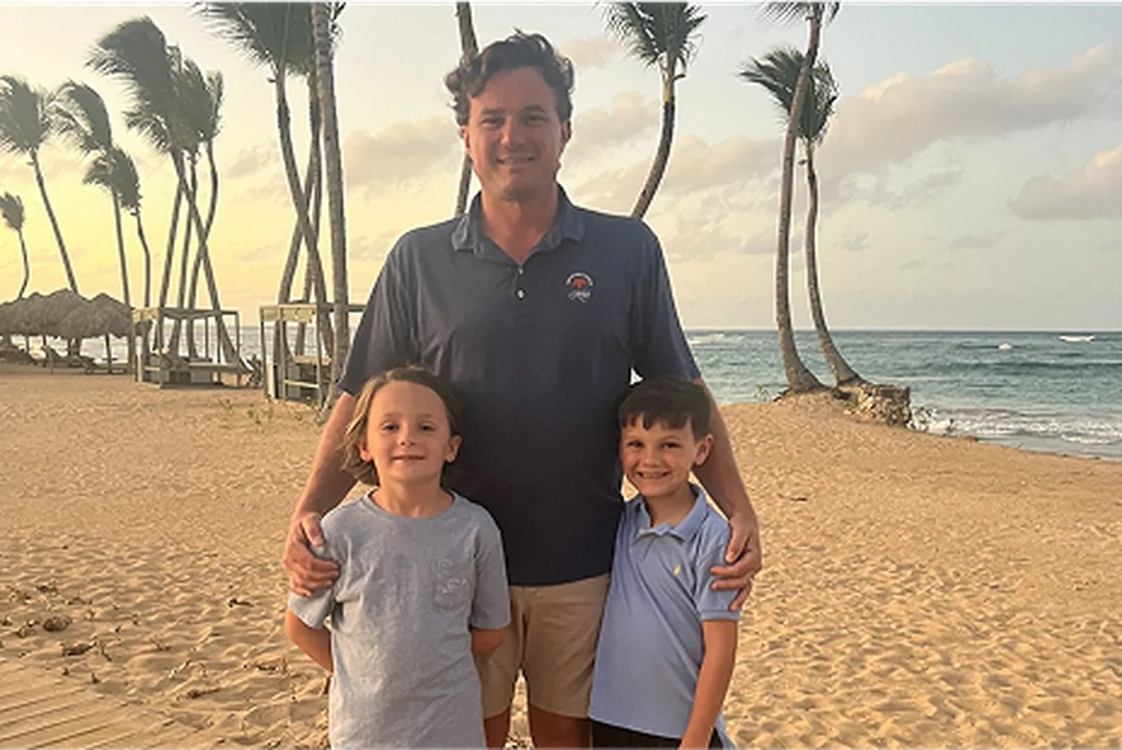 Mitch Guy, Mortgage Loan Officer, with his children on the beach.