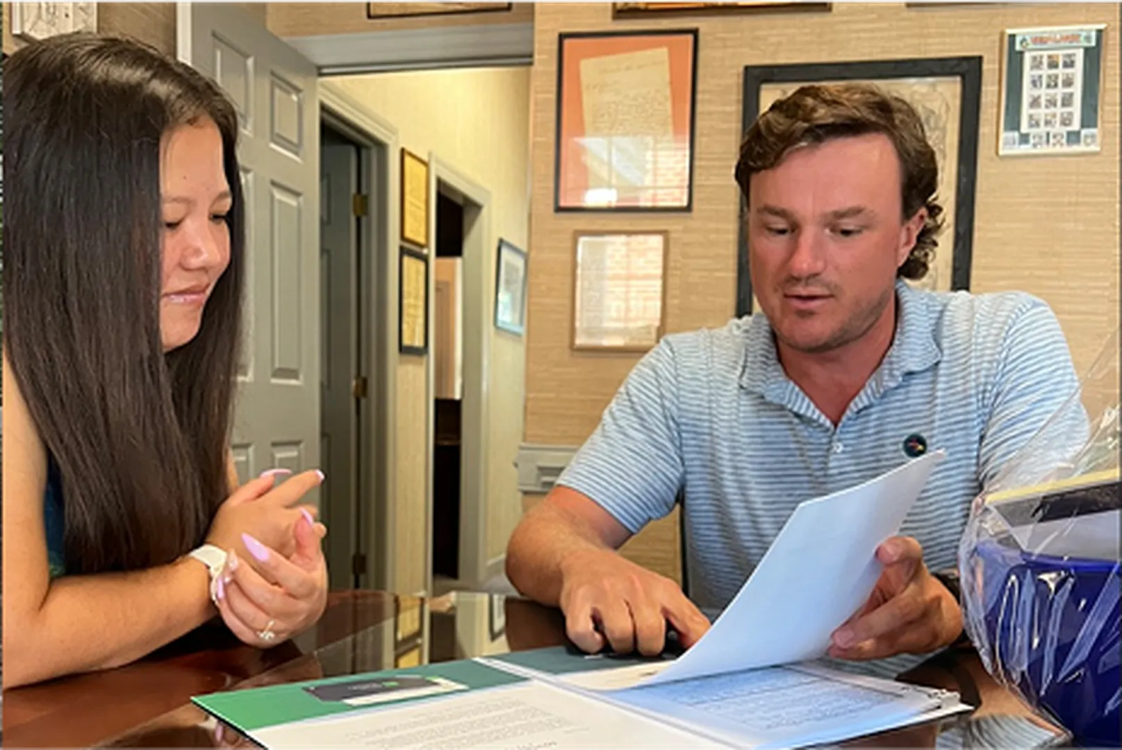 Mitch Guy, Mortgage Loan Officer, with his client.