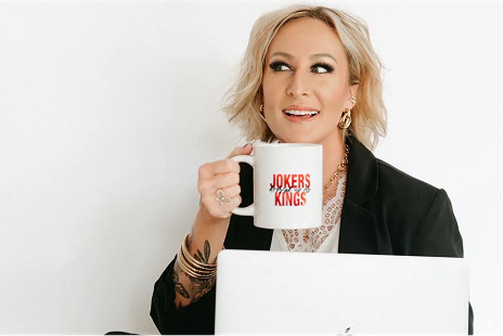 Monaca Vanderpool, Mortgage Loan Officer, pictured holding a coffee cup.