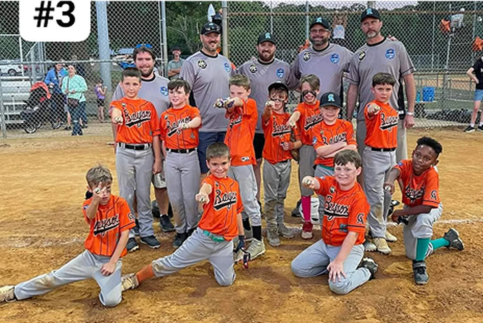 Rick Hennen, Producing Area Manager, with a group of young baseball players.