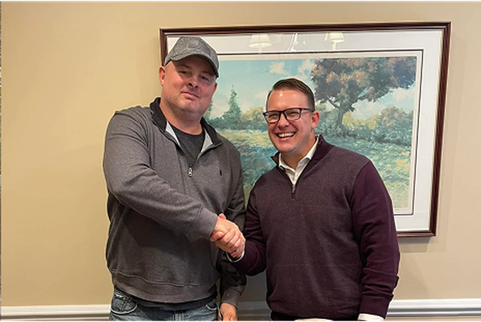 Robert Magruder, Mortgage Loan Officer, pictured shaking hands with a client.