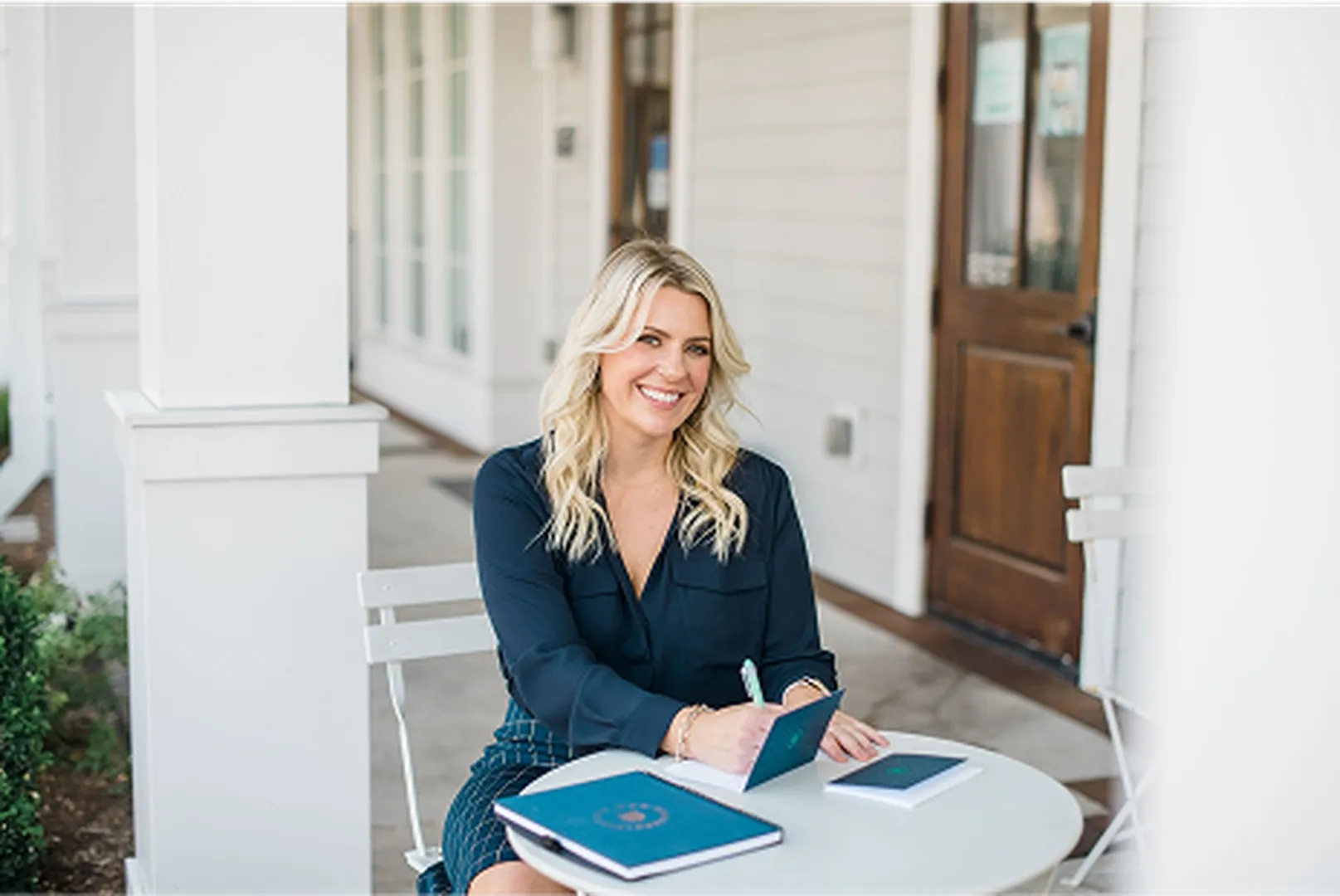 Professional photo of Ryann McLean, Mortgage Loan Officer, engaged in office work.