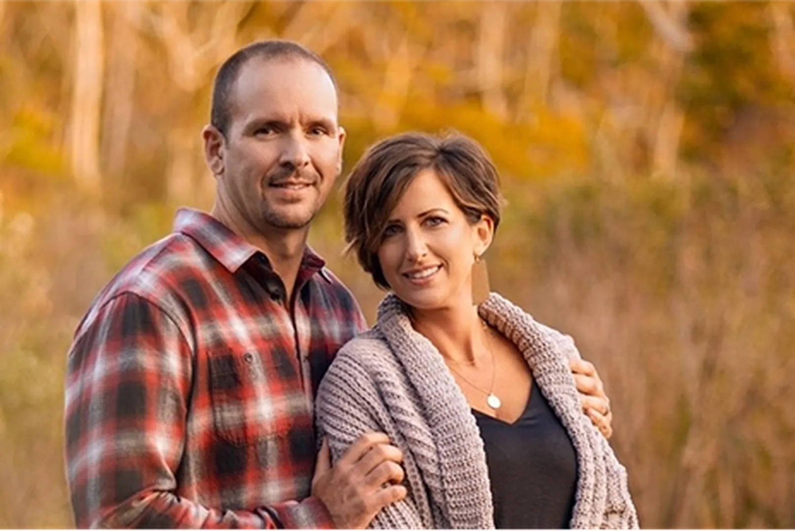Tate Felts, Mortgage Loan Officer, with his wife posing outdoors.