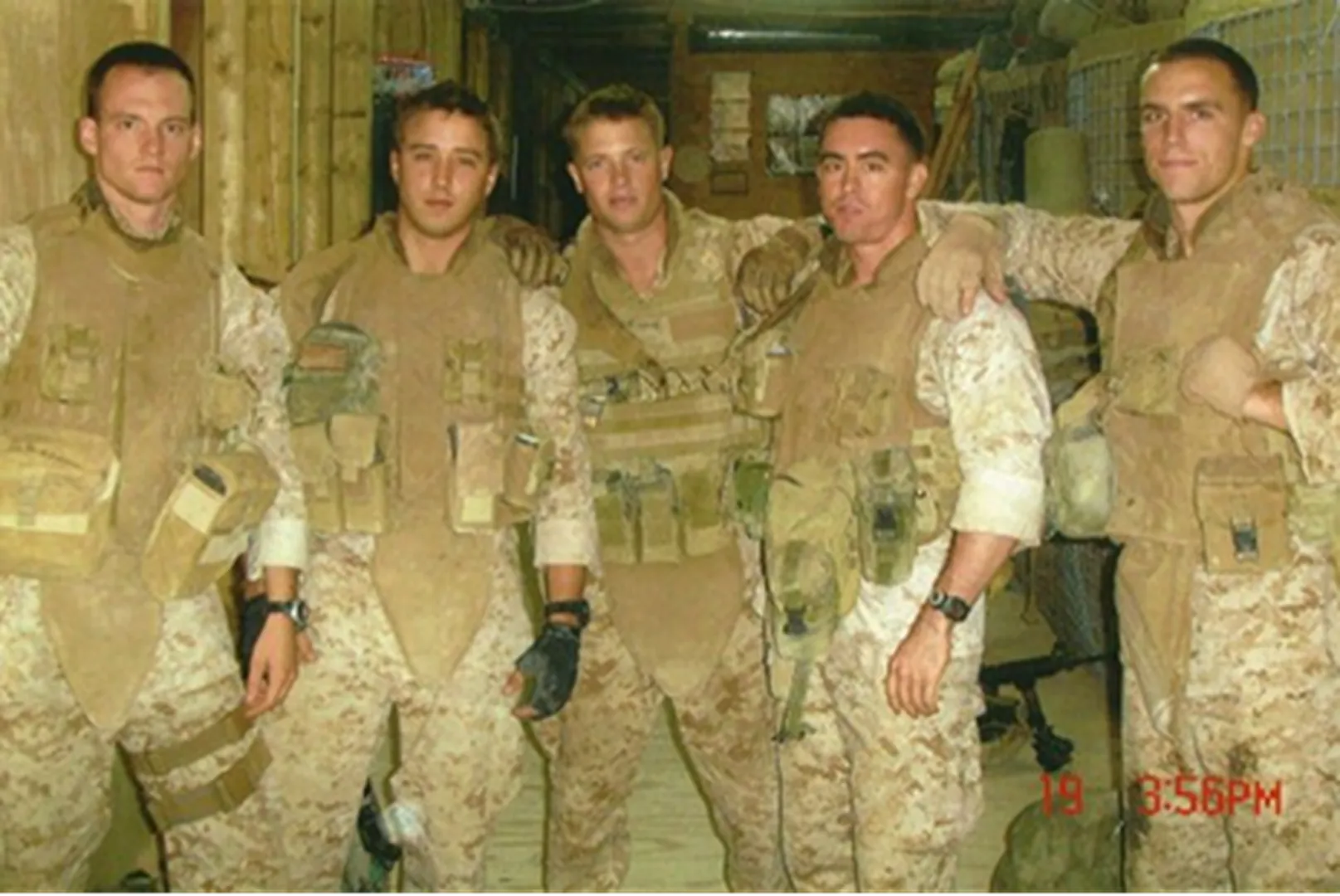 Taylor Flowers, Mortgage Loan Officer, in an old photograph with his firefighting team.